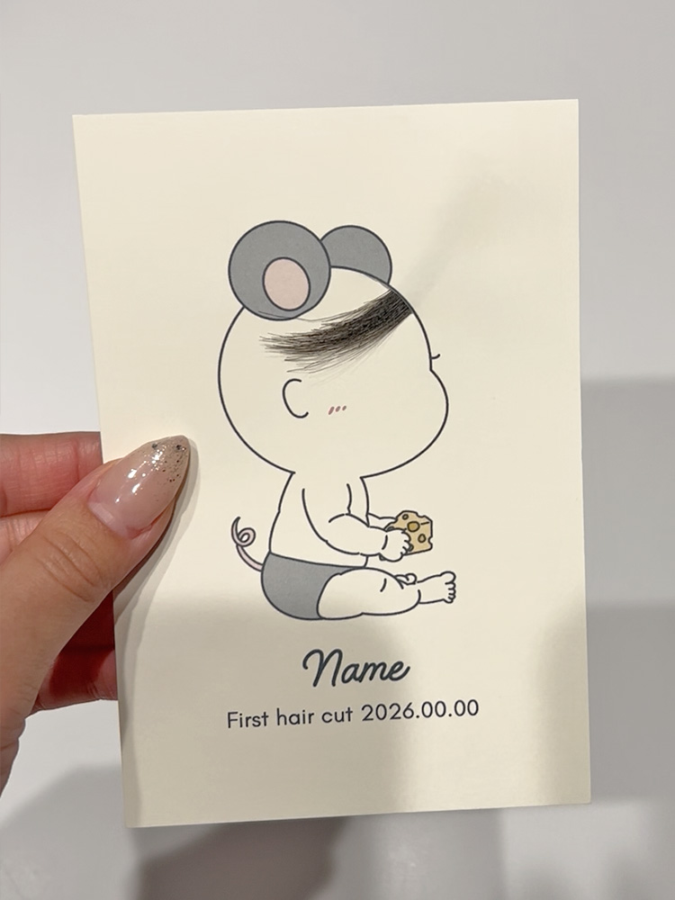 髪の毛を台紙に貼り付ける工程が完了した状態